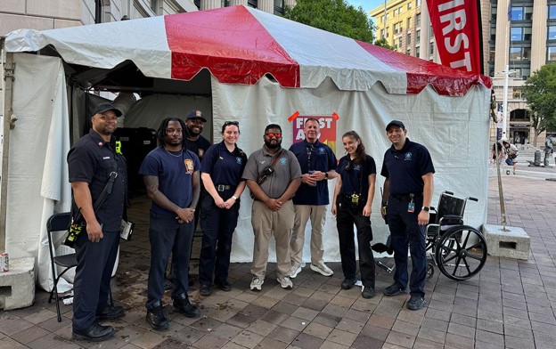The GW Operational Medicine team outside a medical aid station at a street event in Washington, DC.
